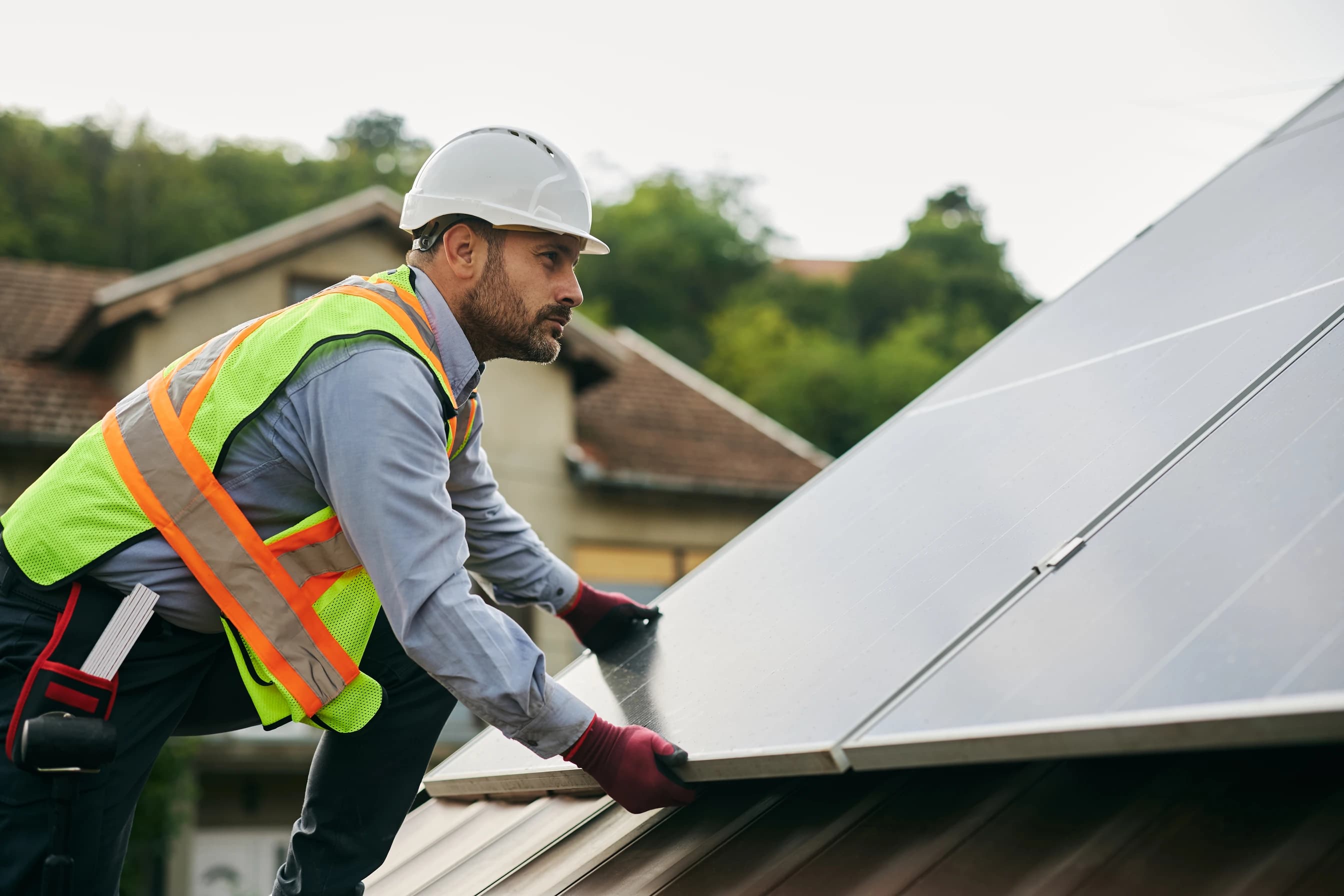 Solar panels being installed on a residential roof